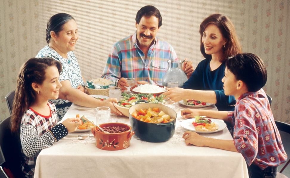 A happy family eating a healthy meal together