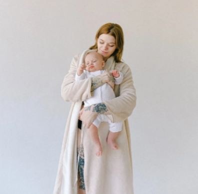 mother-carrying-her-cute-baby