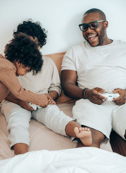 glad-black-father-with-adorable-children-having-fun-at-home