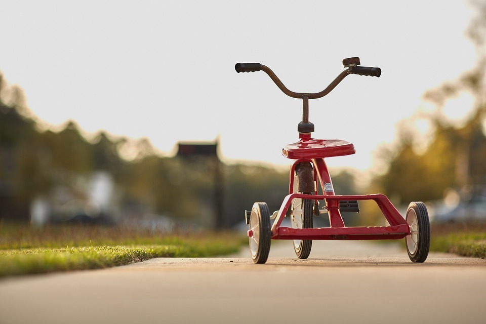 A red tricycle for