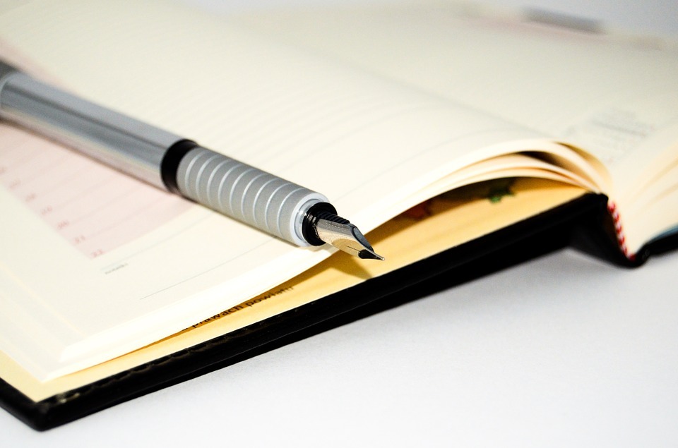 fountain pen, open notebook