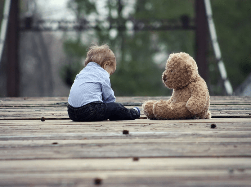child with a teddy bear
