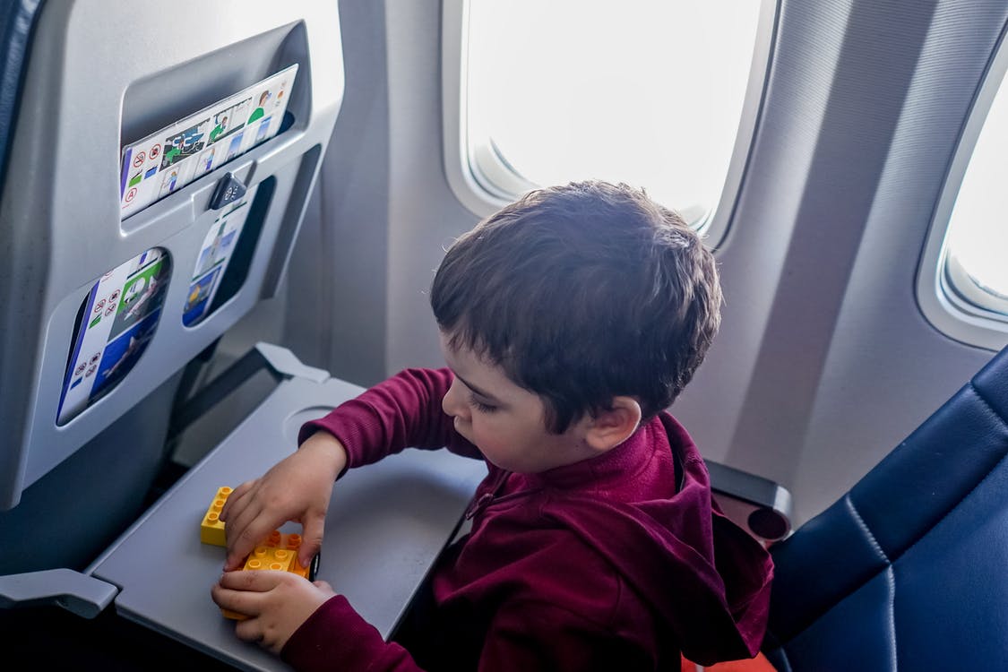Playing Lego on a plane can be a way to distract discomfort in a child